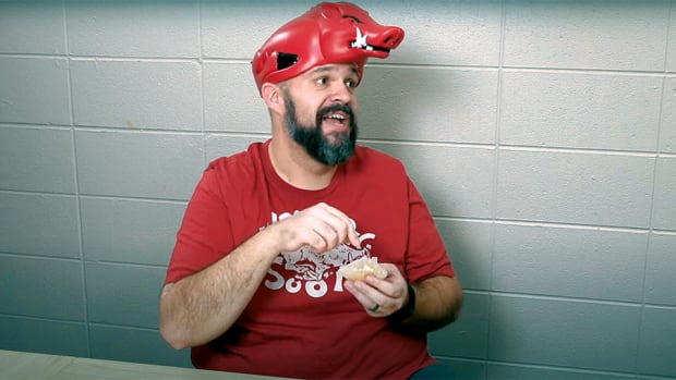 SEC Roll Call depicts Arkansas struggling to eat its Kent State cupcake.